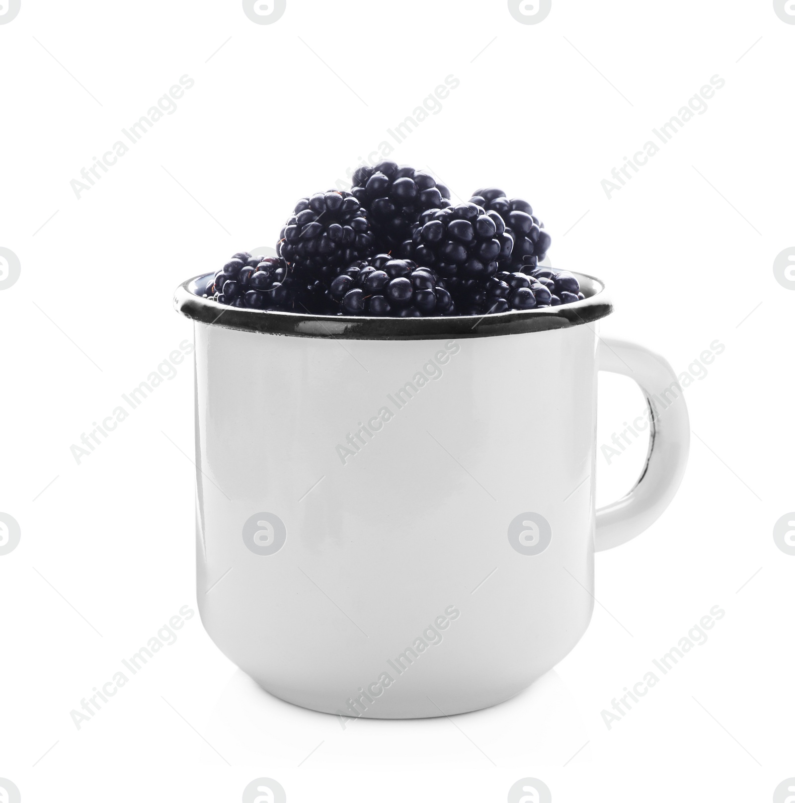 Photo of Mug with ripe blackberries on white background