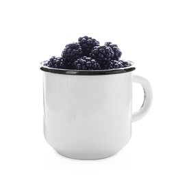 Photo of Mug with ripe blackberries on white background