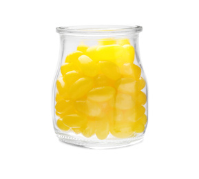 Photo of Tasty small lemon drops in glass jar isolated on white