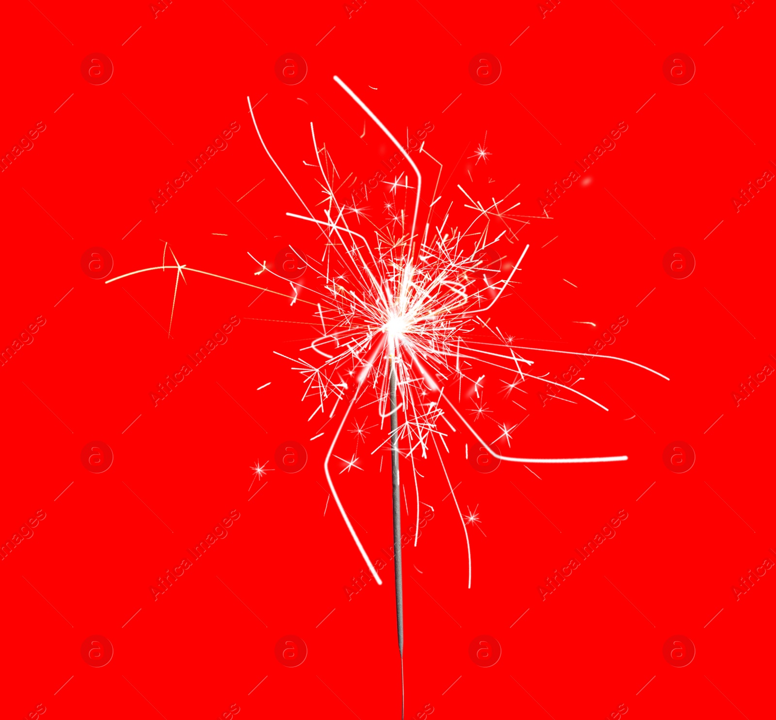 Image of Beautiful sparkler burning on red background. Party decor