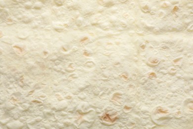 Photo of Texture of thin Armenian lavash as background, top view