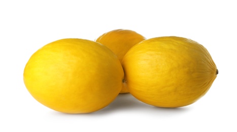 Whole tasty ripe melons on white background