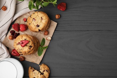Photo of Cookies with freeze dried fruits, mint and nuts on grey table, flat lay. Space for text