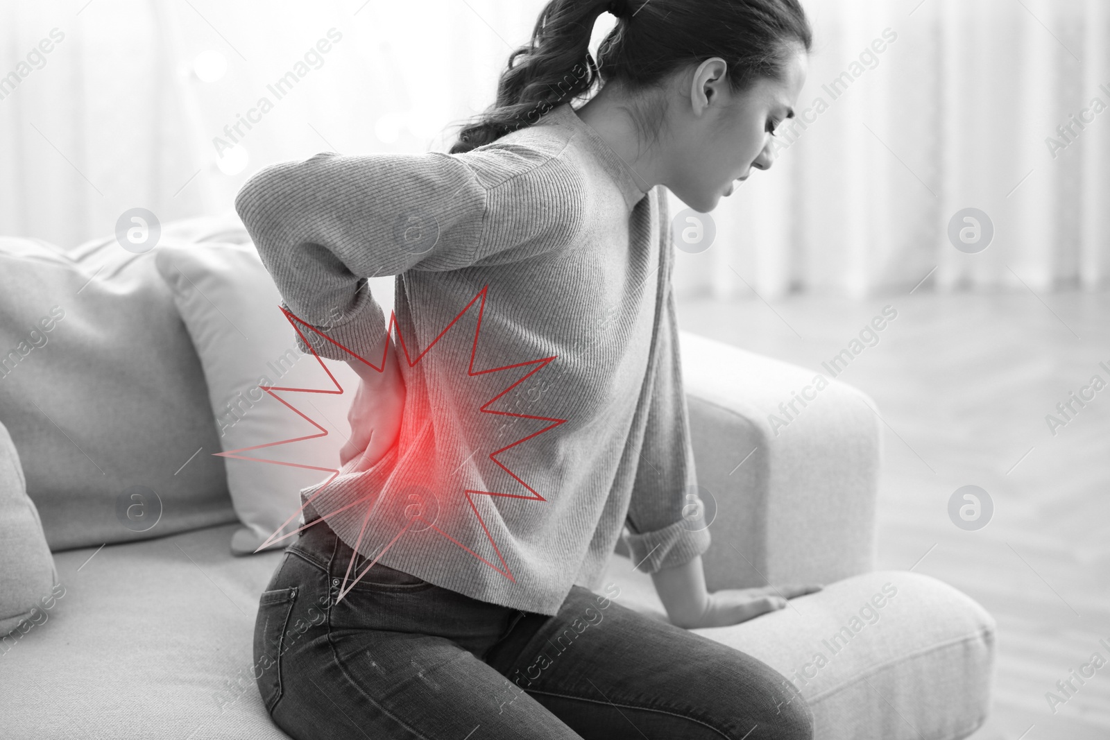 Image of Woman suffering from back pain at home. Bad posture problem