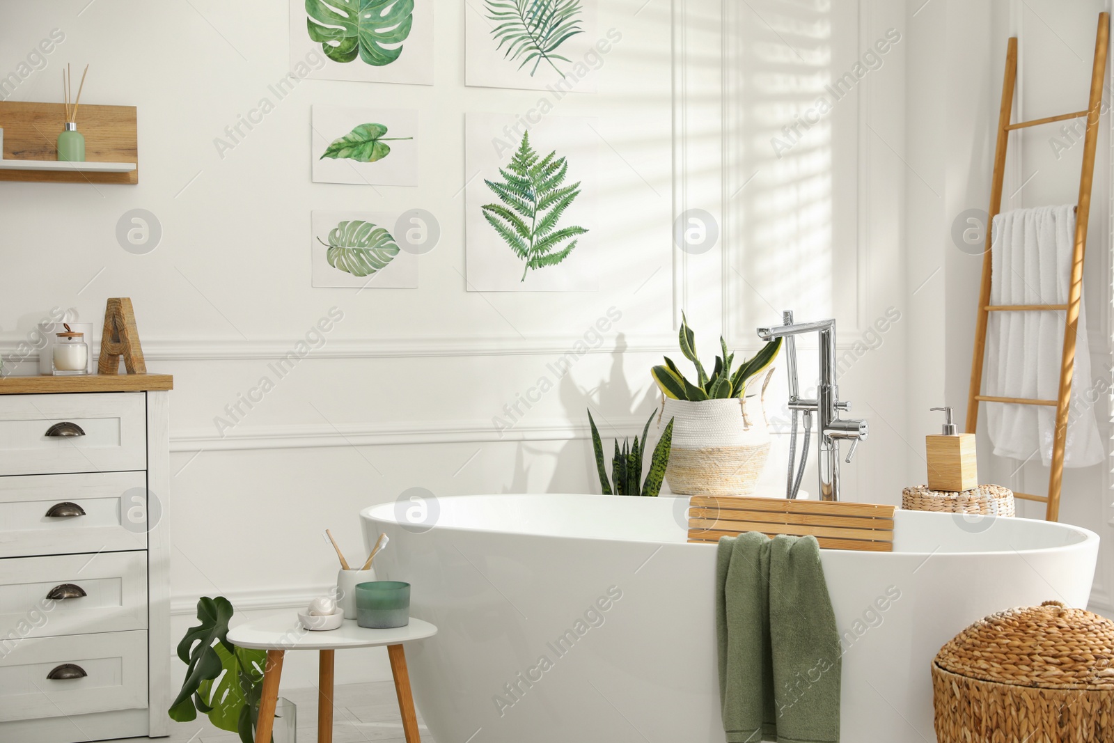 Photo of Stylish bathroom interior with green plants. Home design