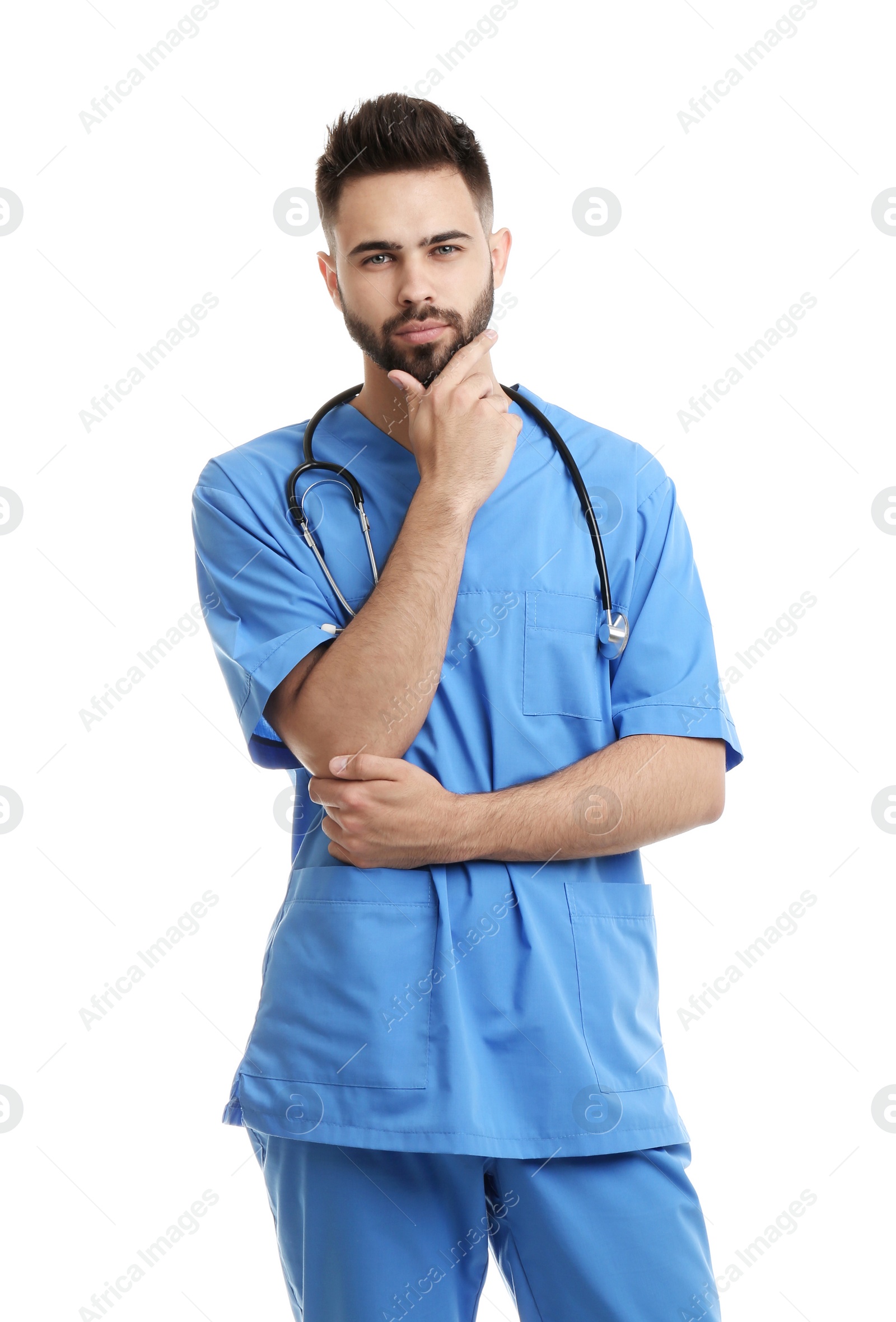 Photo of Young male doctor in uniform isolated on white