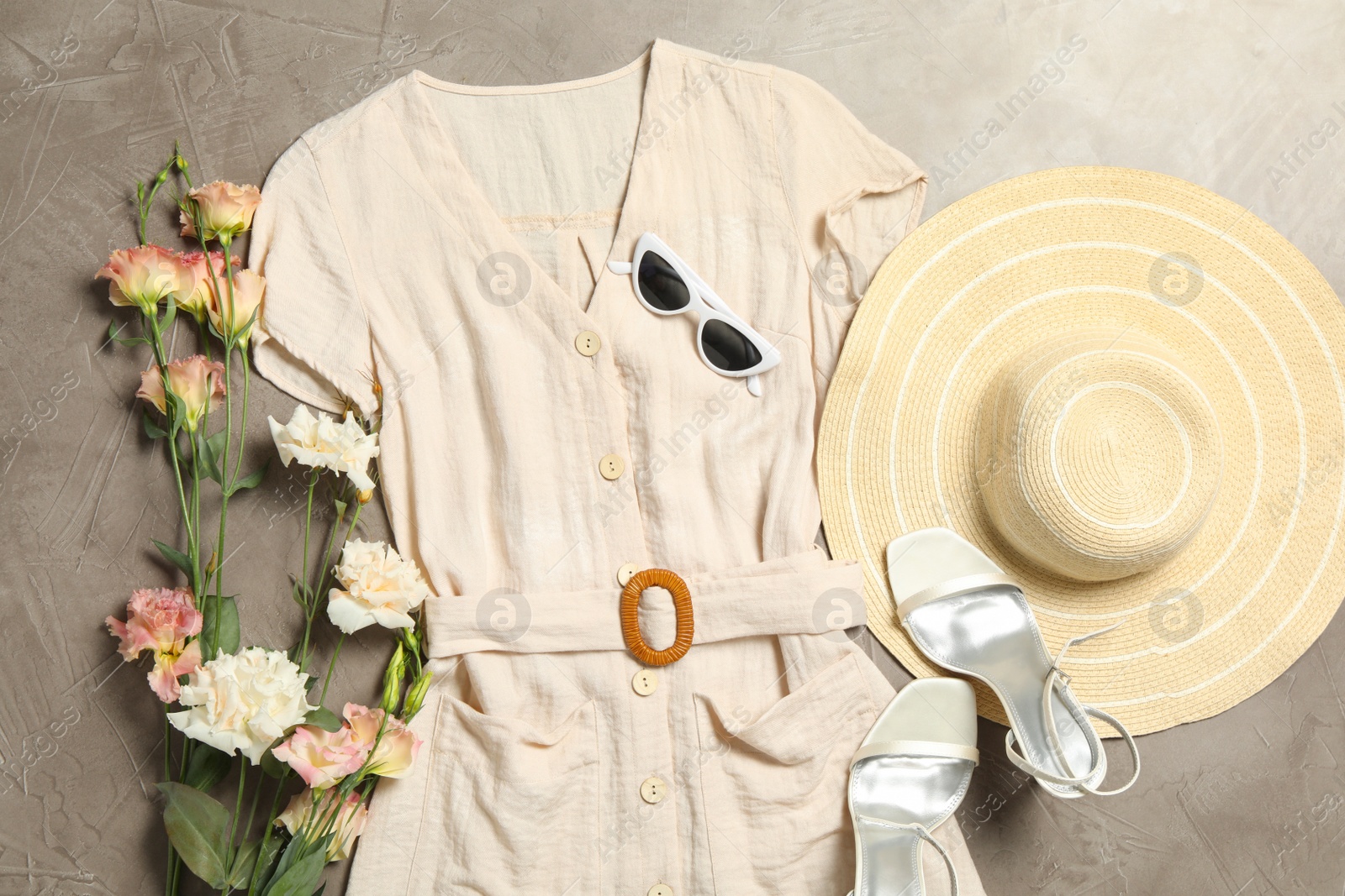 Photo of Flat lay composition with stylish dress on grey stone background