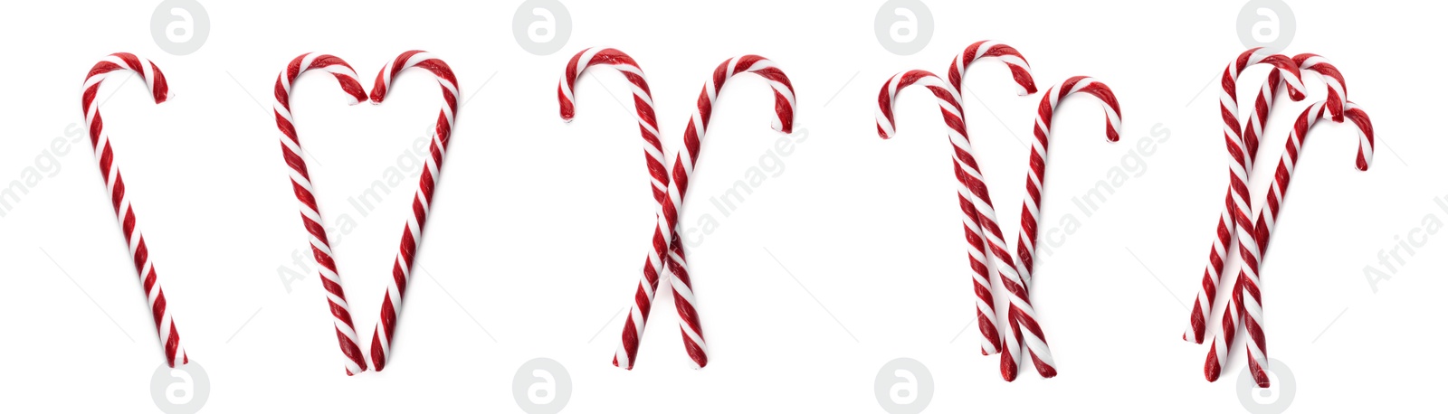 Image of Set with yummy sweet Christmas candy canes on white background, top view. Banner design