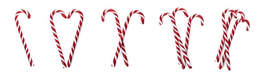 Image of Set with yummy sweet Christmas candy canes on white background, top view. Banner design