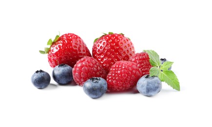 Many different ripe berries and mint leaves isolated on white