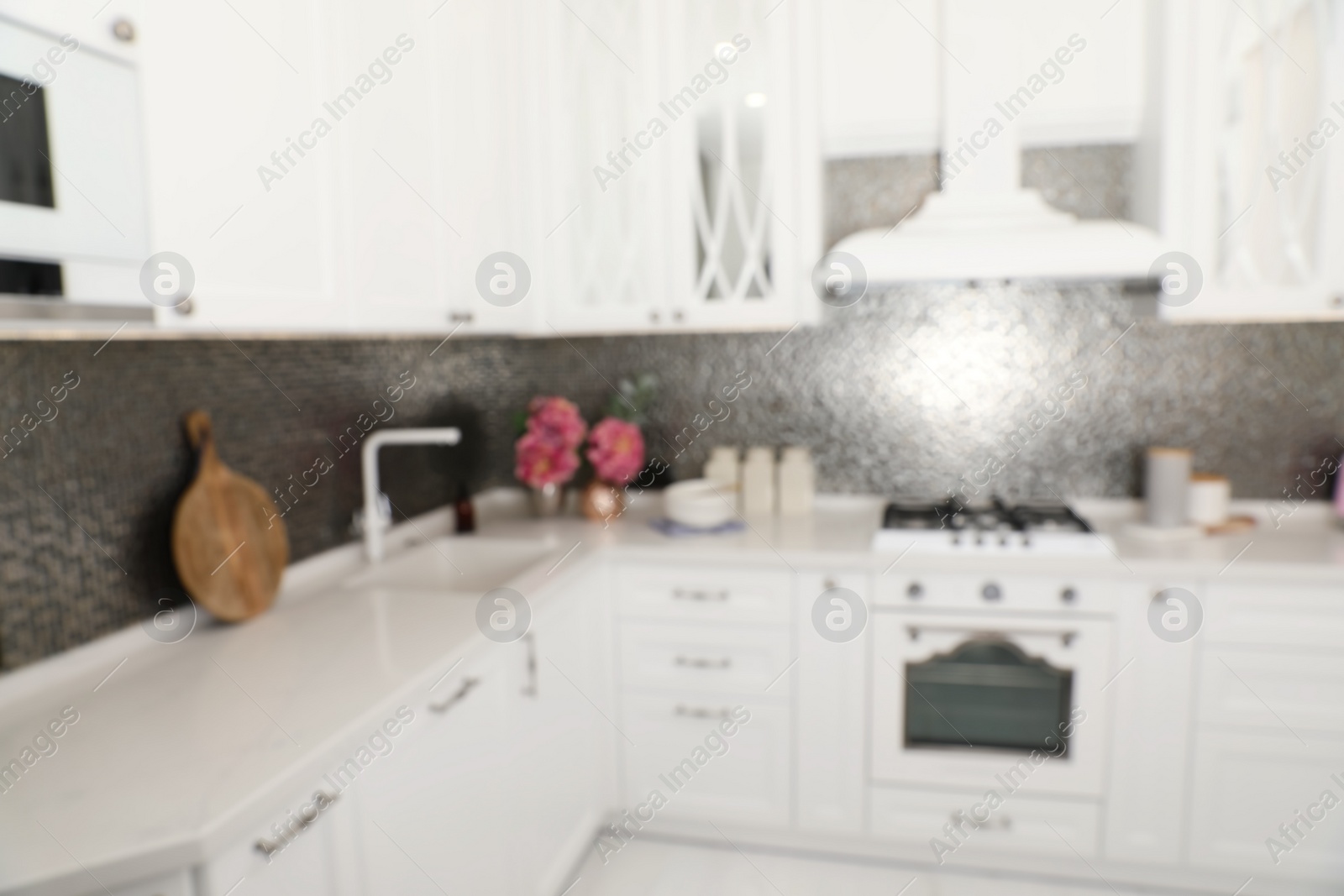 Photo of Blurred view of beautiful kitchen interior with new stylish furniture