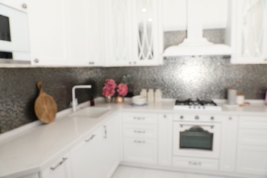 Photo of Blurred view of beautiful kitchen interior with new stylish furniture