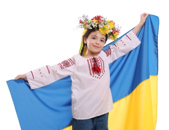 Photo of Little girl in national clothes with flag of Ukraine on white background