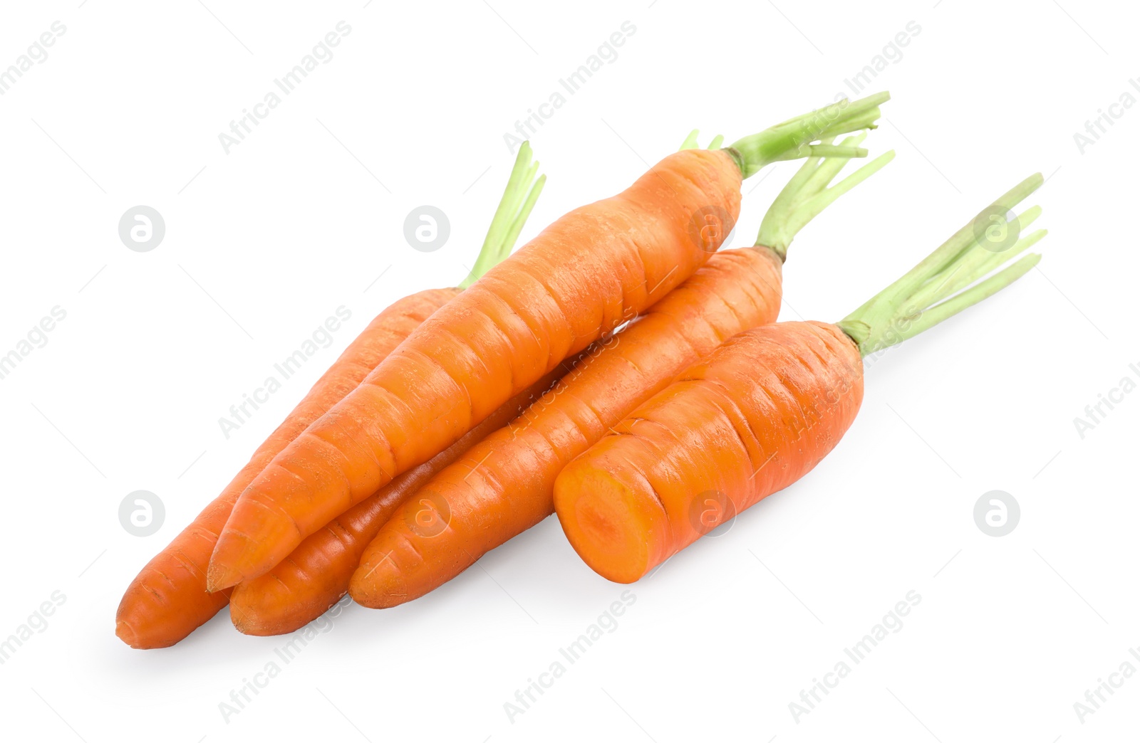 Cut and whole ripe carrots isolated on white Photo of Cut and whole ripe carrots isolated on white