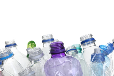 Pile of crumpled bottles on white background, closeup. Plastic recycling