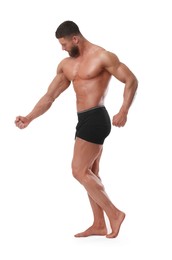 Photo of Young bodybuilder with muscular body on white background