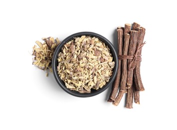 Dried sticks of liquorice root and shavings on white background, top view