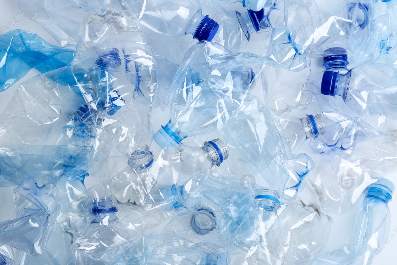 Photo of Many used plastic bottles as background, top view. Recycling problem