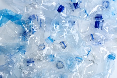 Many used plastic bottles as background, top view. Recycling problem