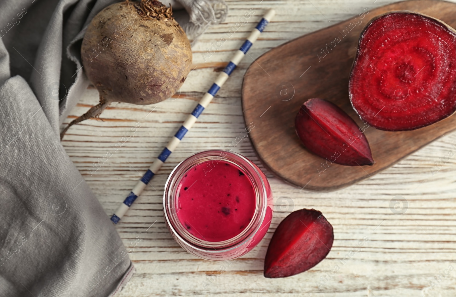 Photo of Flat lay composition with healthy detox smoothie and beet on wooden background