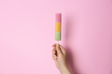 Photo of Woman holding delicious ice cream against color background