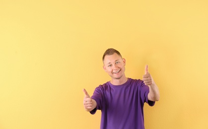 Portrait of handsome man on color background