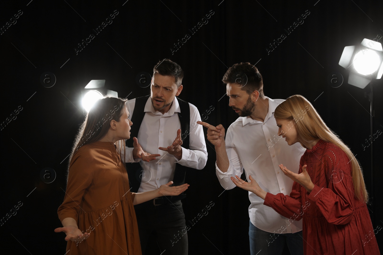 Photo of Professional actors rehearsing on stage in theatre