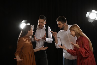 Professional actors rehearsing on stage in theatre