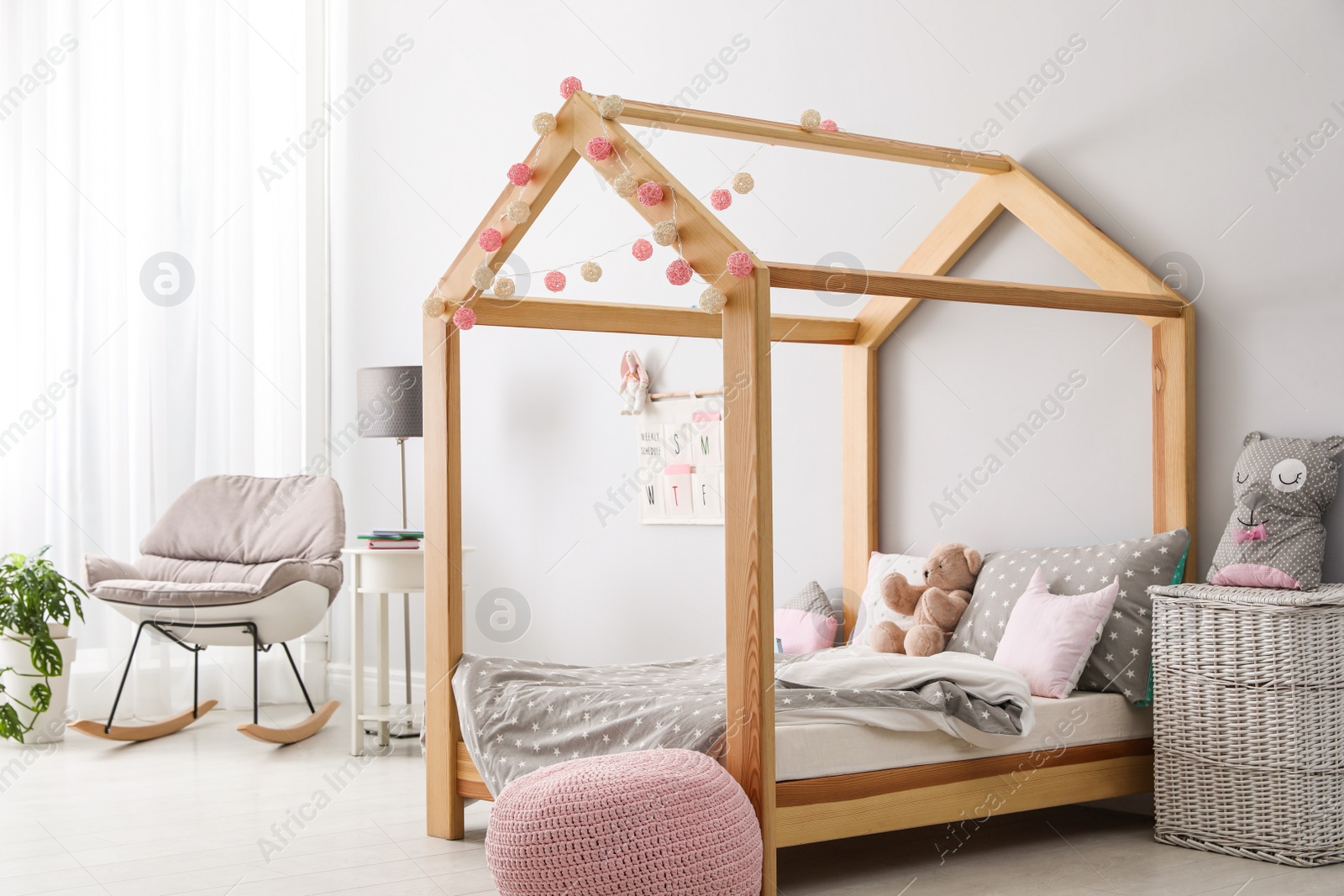 Photo of Stylish child room interior with comfortable bed