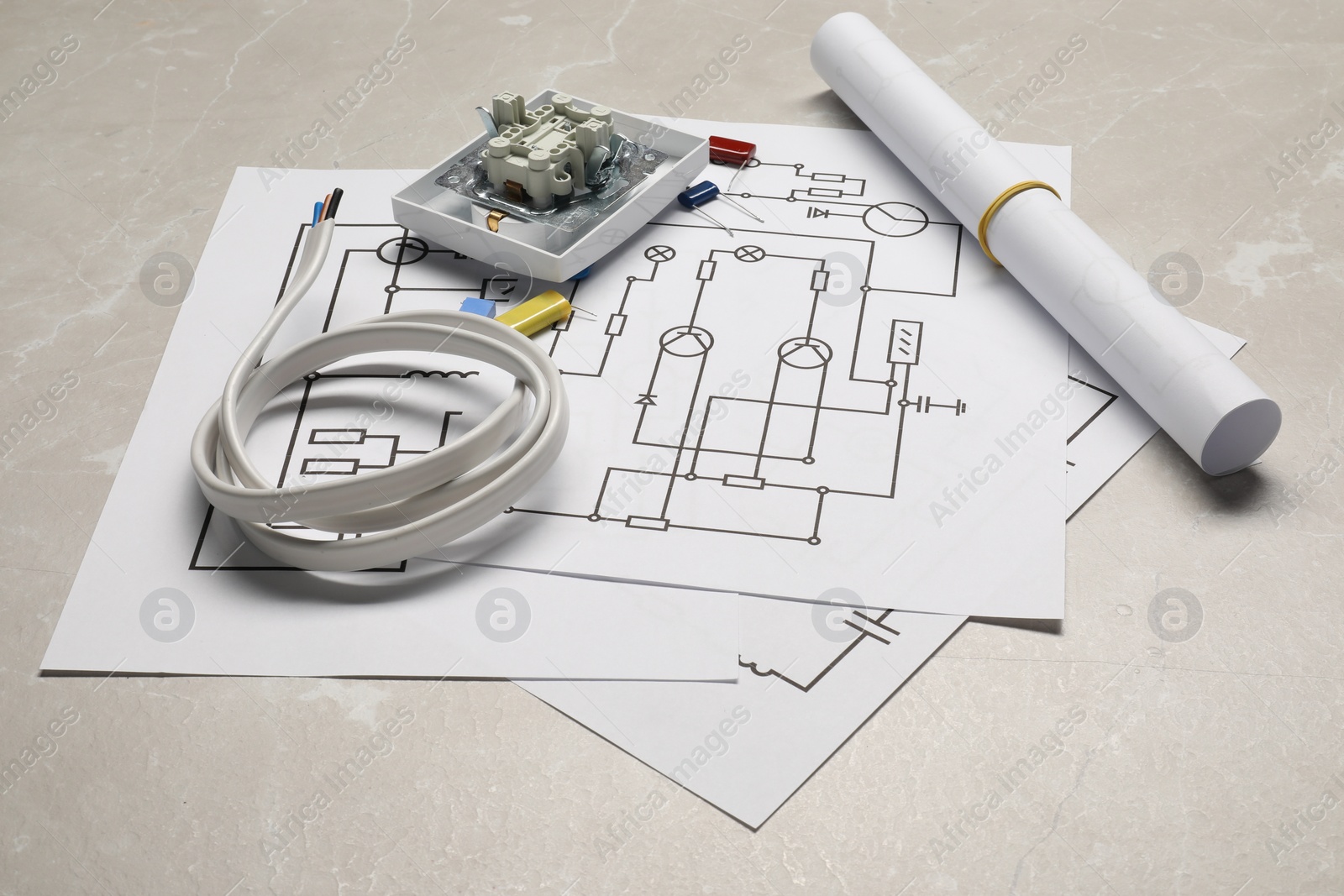 Photo of Wiring diagrams, wires and disassembled light switch on table