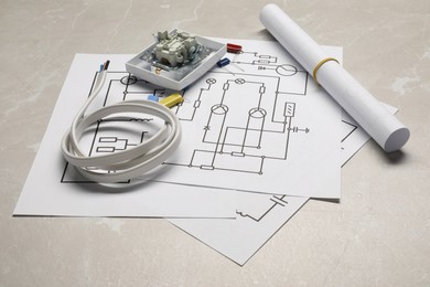 Photo of Wiring diagrams, wires and disassembled light switch on table