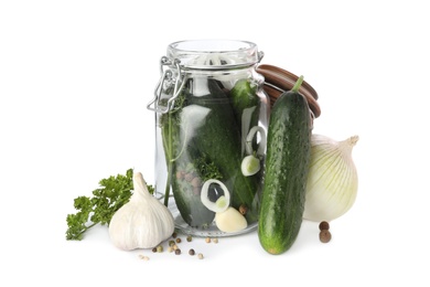 Photo of Pickling jar with fresh ripe cucumbers and spices on  white background