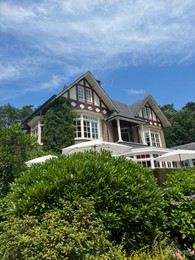 Picturesque view of beautiful house and plants on sunny day