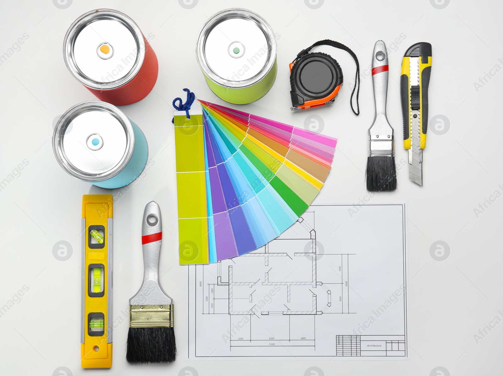 Photo of Set of decorator's tools and project drawing on light background