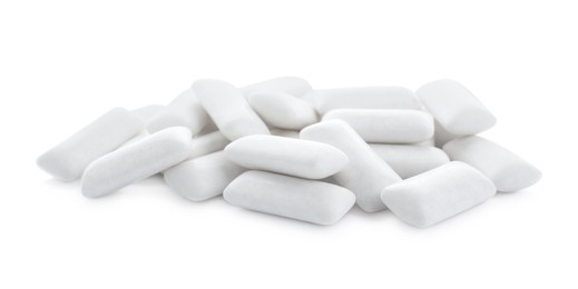 Photo of Heap of chewing gum pieces on white background