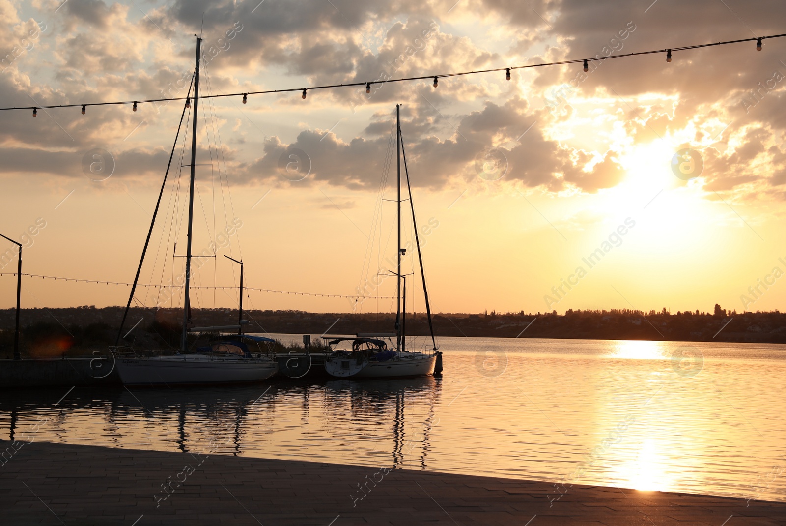 Photo of Beautiful view of river pier at sunset