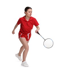 Young woman playing badminton with racket on white background