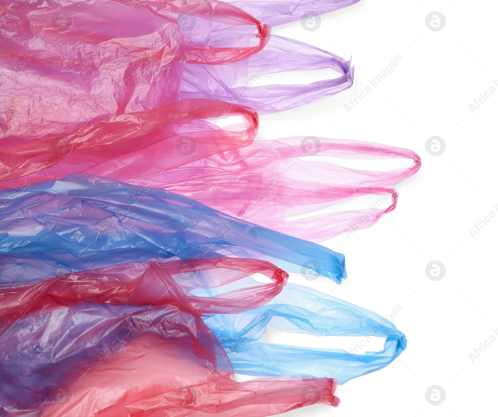 Photo of Many different plastic bags on white background