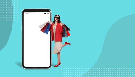Image of Happy stylish woman with shopping bags near huge smartphone on color background. Advertising mockup with space for design