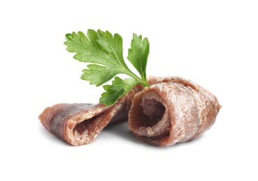 Photo of Delicious anchovy fillets with parsley on white background