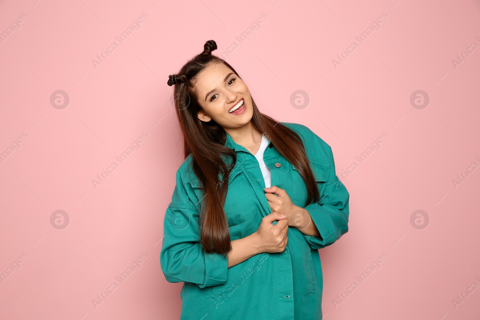 Photo of Portrait of beautiful young woman in stylish clothes on color background