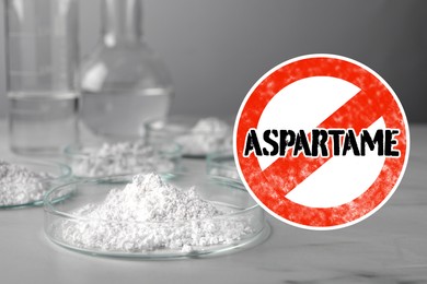 Image of Prohibition sign with word Aspartame symbolizing restriction on use of sugar substitute. Artificial sweetener in Petri dishes on gray table