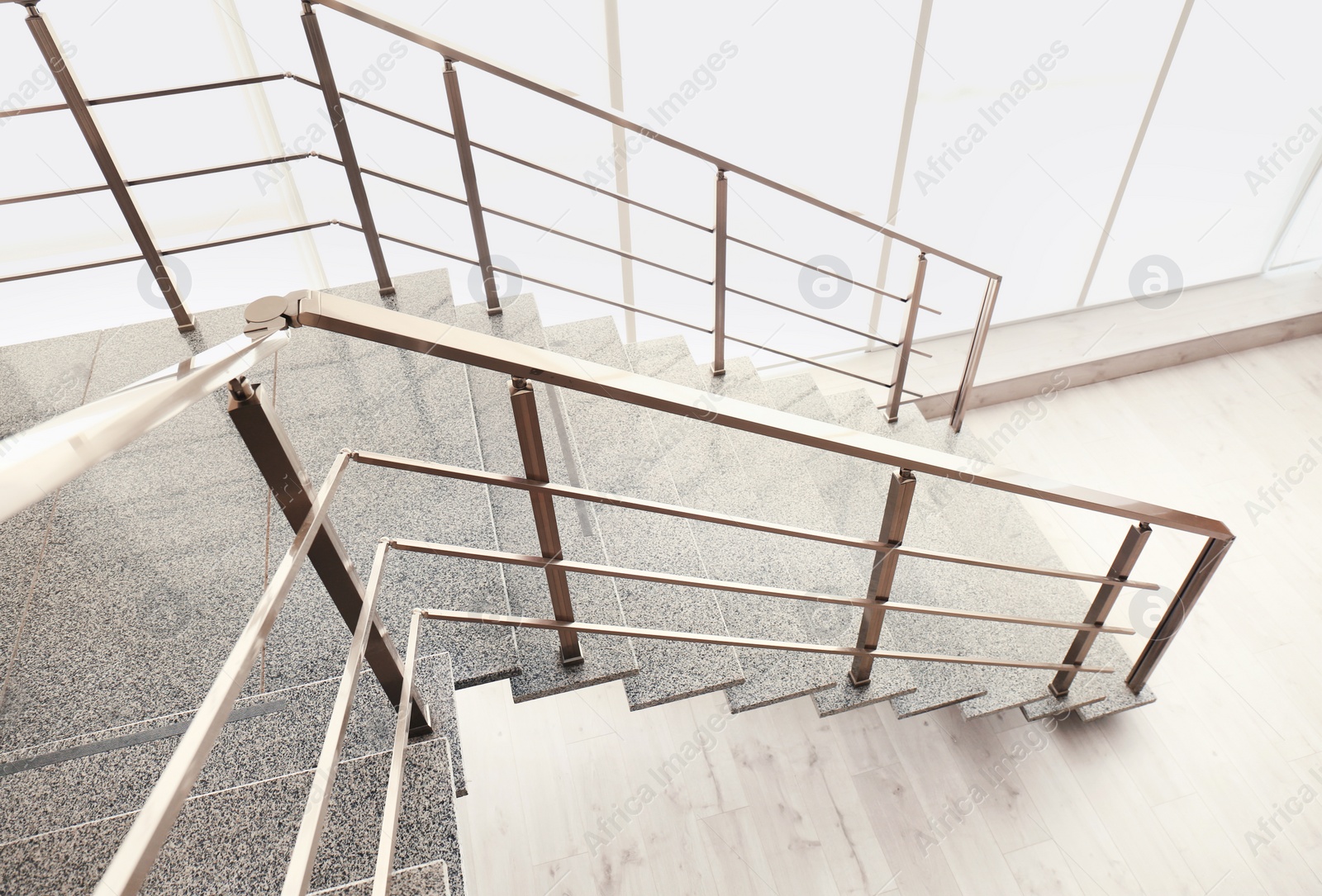 Photo of Stone stairs with metal railing indoors, view through CCTV camera