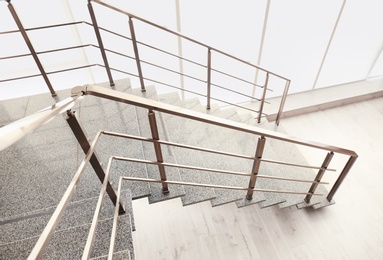 Stone stairs with metal railing indoors, view through CCTV camera