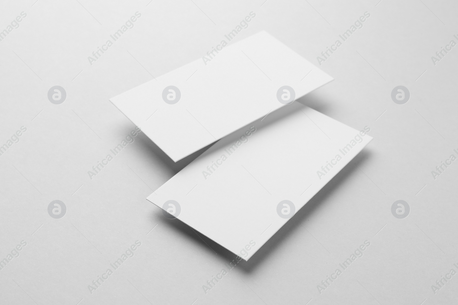 Photo of Blank business cards on light grey background. Mockup for design