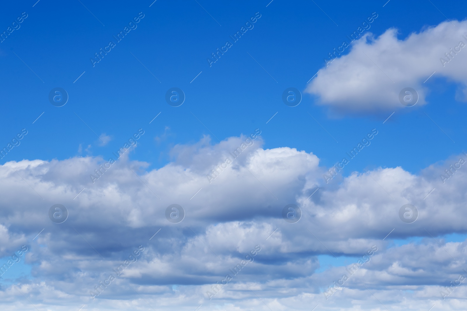 Photo of Picturesque blue sky with white clouds on sunny day