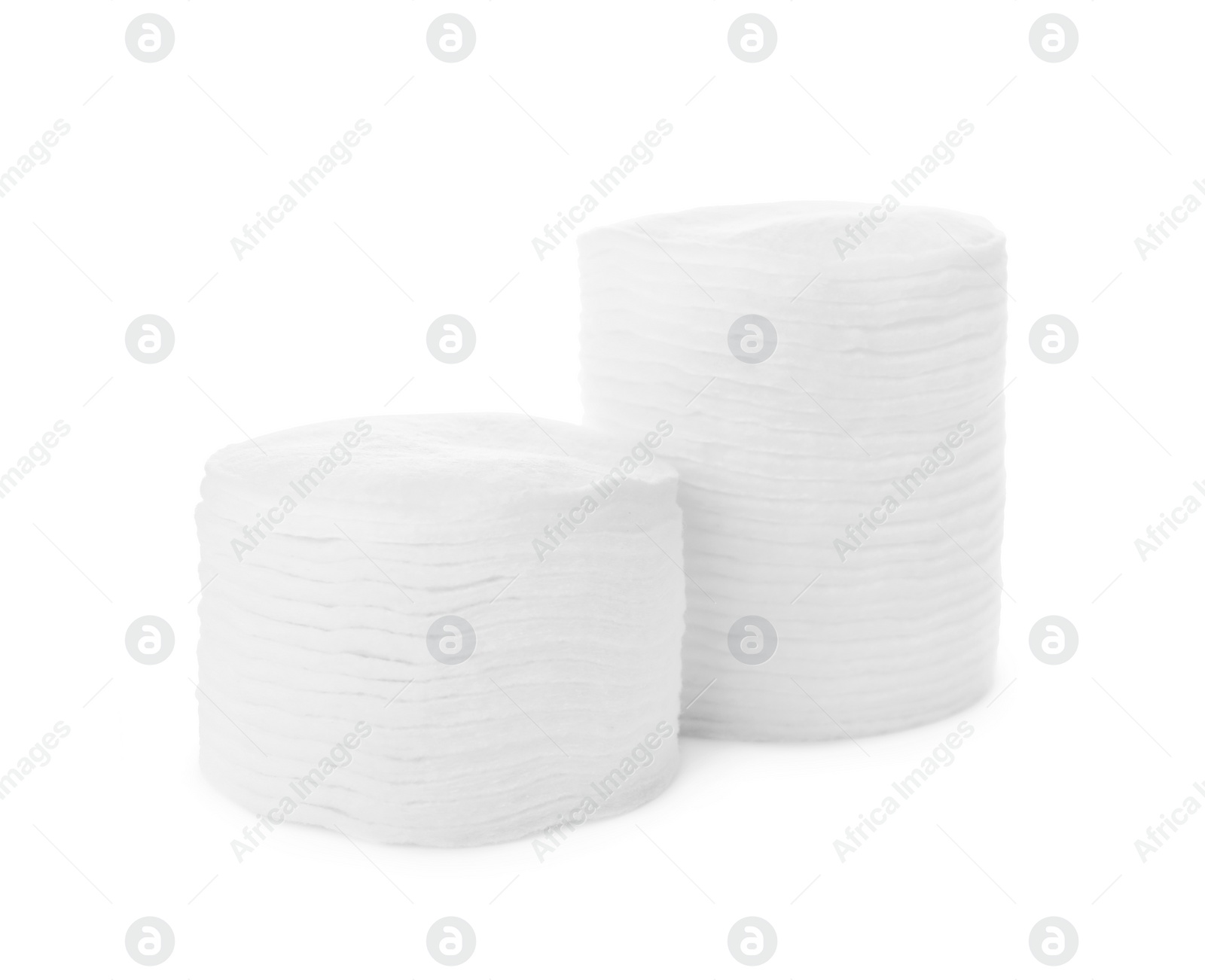 Photo of Stacks of cotton pads on white background