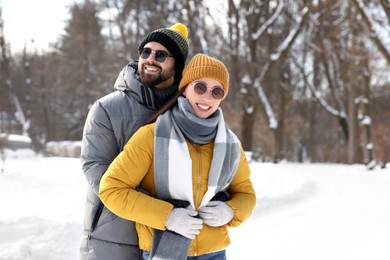 Photo of Beautiful happy couple spending time together on winter day