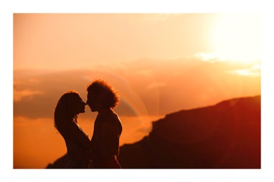 Image of Paper photo. Young lovely couple at sunset 