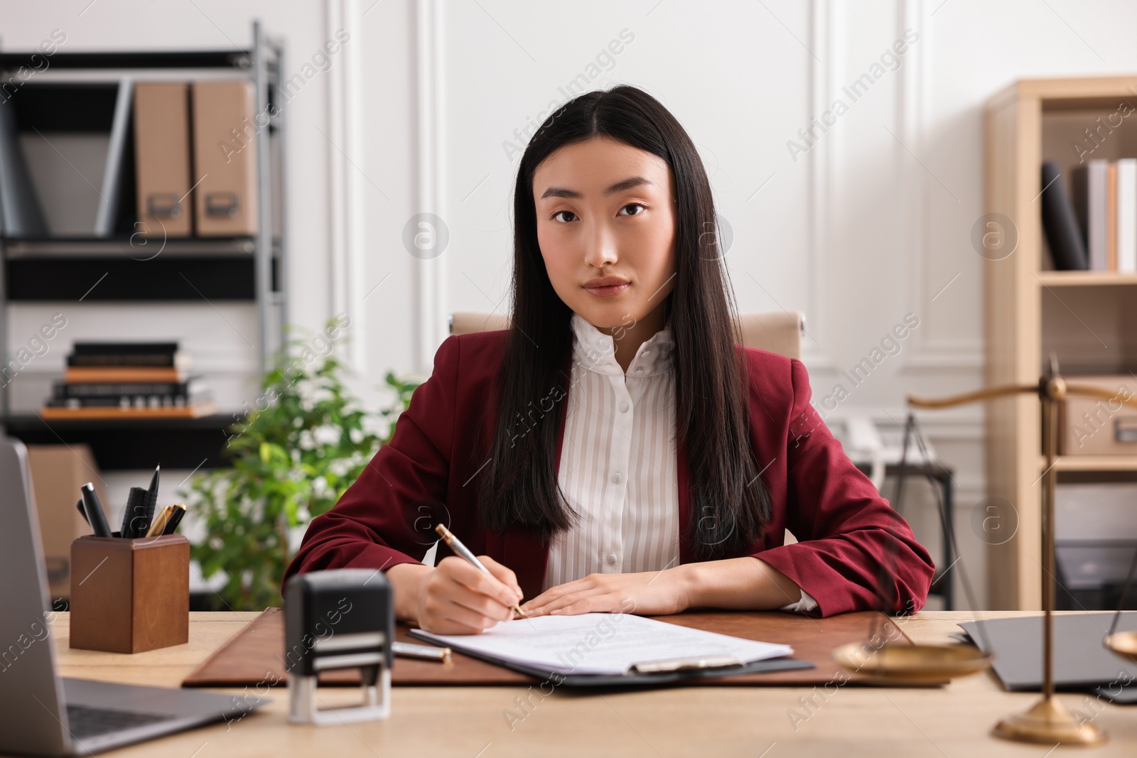 Photo of Portrait of notary at table in office